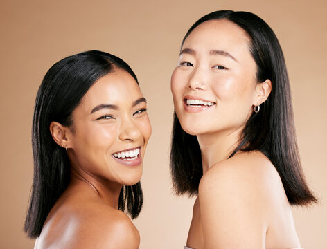 Diverse, beauty and portrait of women with makeup isolated on a studio background. Smile, dermatology and face of model friends with happiness for foundation shade diversity on a beige backdrop
