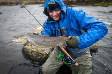 Brown sea trout trophy under winter fishing