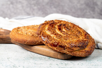 Poppy bread. Bread prepared with poppy on stone background. close up