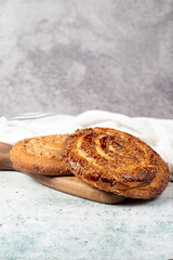 Poppy bread. Bread prepared with poppy on stone background. close up