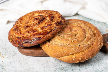 Poppy bread. Bread prepared with poppy on stone background. close up
