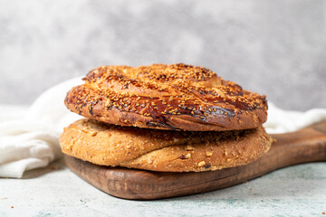 Poppy bread. Bread prepared with poppy on stone background. close up
