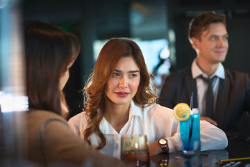 Rooftop bar with pretty woman and friend and cocktail for hangout and party