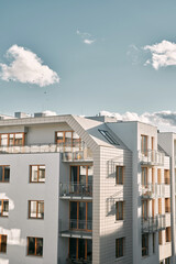 New modern apartment complex. Low-rise European apartment building complex with outdoor facilities.