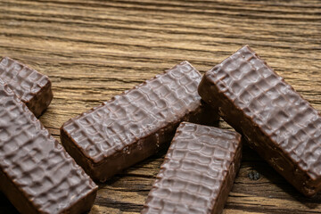 Chocolate cookies on wooden table.