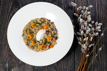 risotto with vegetables and cheese in a plate

