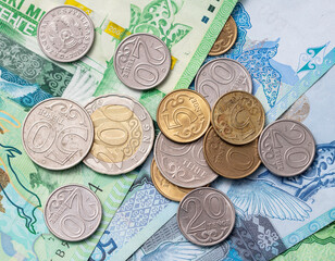 Coins on Tenge banknotes of Kazakhstan.