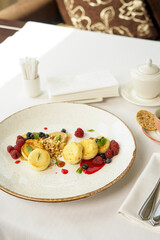 breakfast dessert sweet cheesecakes with berries in a plate
