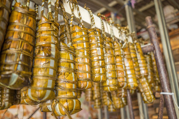 Focus Vietnamese Sticky Rice Cake (tet cake) hang in shelves after hard-boiled, Vietnamese...