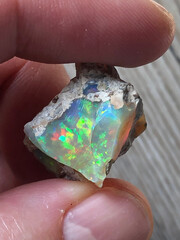 Closeup view of a big colorful piece of rough opal