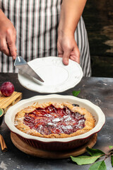 plum cake, powdered sugar is sprinkled on the cake Culinary, cooking, bakery concept. banner, menu, recipe place for text
