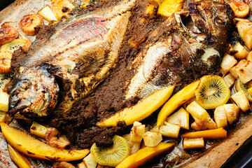 Fried fish in fruit, food background