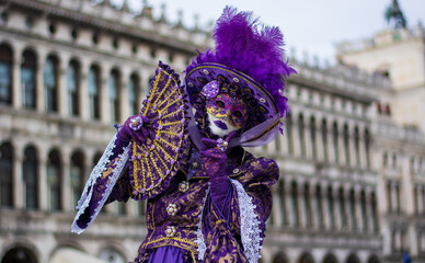 the beautiful purple costume at the carnival in Piazza San Marco in Venice © corradobarattaphotos