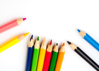 Colored pencils on white background. Stationery