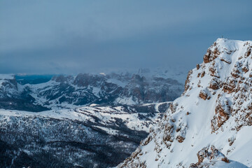 Stormy clouds in italian dolomites in a snowy winter