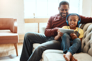 Tablet, sofa and father with his son watching a funny, comic or meme video on social media. Happy, smile and African man streaming a movie with his boy child on mobile device while relaxing together.