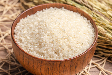 Fototapeta na wymiar White rice, Masu and ears of rice on a white background