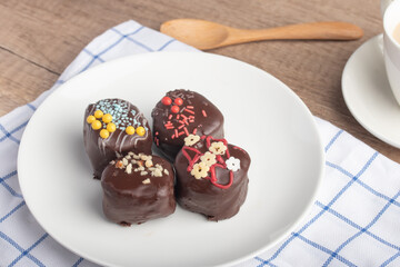 Chocolate ball snacks on a white plate