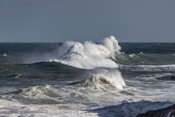 Storm of rain, wind, waves and snow in Asturias. Winter storm and weather alert in Spain. Llanes, Asturias, Spain. 