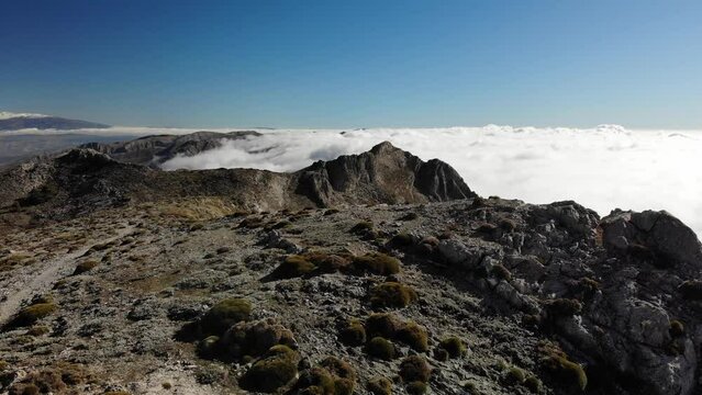 4K drone footage over mountain range with breathtaking sea of clouds on one side at La Maroma, Malaga, Spain.
Mid angle, traveling movement.
