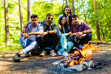 Multiracial pakistanian happy friends at picnic camping park