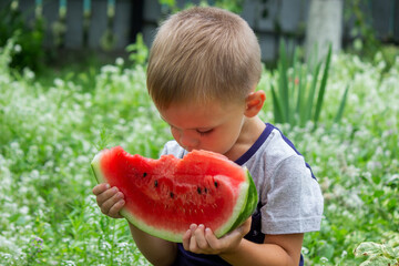 A child eats watermelon. Selective focus.