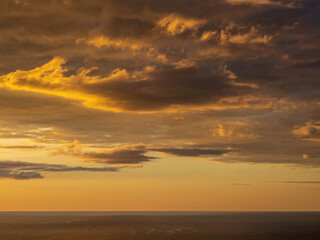Sunset over Tasman sea at Piha beach, Auckland, New Zealand