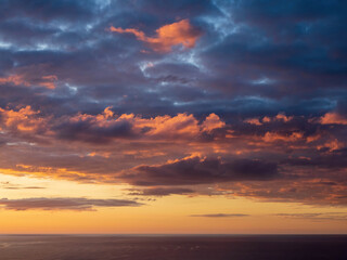Naklejka na ściany i meble Sunset over Tasman sea at Piha beach, Auckland, New Zealand
