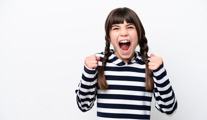 Little caucasian girl isolated on white background celebrating a victory in winner position