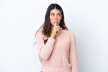 Young Italian woman isolated on white background showing a sign of silence gesture putting finger...