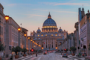 Fototapeta na wymiar View of Illuminated Saint Peter`s Basilica and Street Via della Conciliazione, Rome, Italy