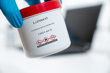 Li2NbO3 lithium metaniobate CAS 12031-63-9 chemical substance in white plastic laboratory packaging