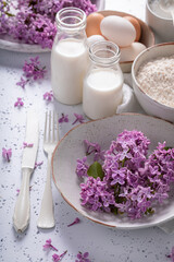 Obraz na płótnie Canvas Ingredients for fried lilac flower. Lilac flowers fried in oil.