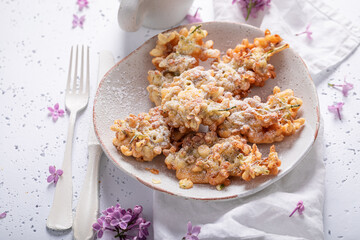 Delicious and sweet fried lilac flower with powdered sugar.