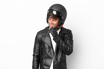 Young man with a motorcycle helmet isolated on white background looking to the side and smiling
