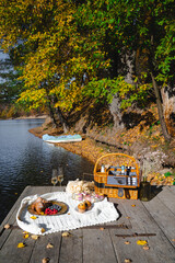Picnic by the lake during autumn with vibrant foliage and a serene atmosphere