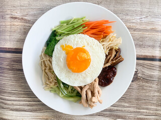 fried egg with bacon and vegetables