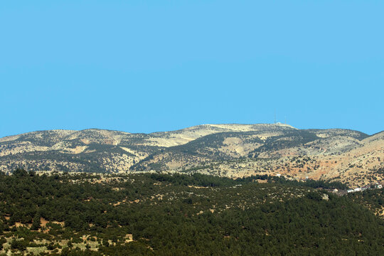 A far view of the peak of Ahir Mountain in Kahramanmaras province, Turkey in afternoon in a sunny winter day