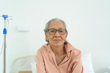 Portrait of happy smiling Asian sick old female senior elderly patient, woman person in hospital in medical healthcare concept. People lifestyle.