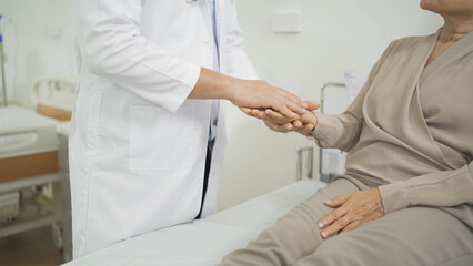 Obraz premium Portrait of Asian doctor check up body of sick old senior elderly patient on bed in hospital in medical and healthcare treatment at nursing home. People lifestyle