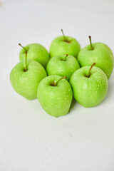 Apple ripe green apples on a white background, harvest fruits concept. Top view