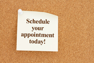 Schedule your appointment today message on yellow sticky note on a corkboard