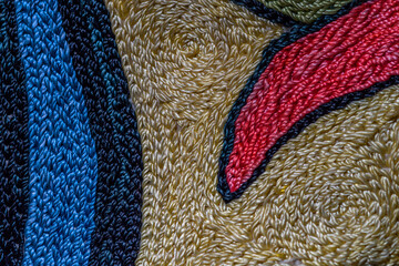 Abstract background closeup of embroidery with art stitches. Rough Coarse thread, thick seams....