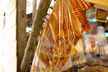 Dried fish and seafood on the market in Thailand. Delicious delicacies of sea fishing.
