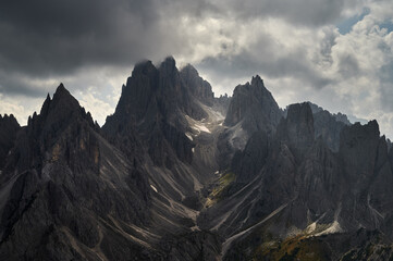 Cadini di Misurina, scenic view in the Dolomites, Italian Alps, playing lights, sun with clouds and mountains, Italy, Europe
