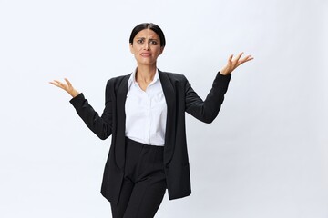 Business woman in black business suit shows signals gestures and emotions on white background, freelancer job online time management, teacher science