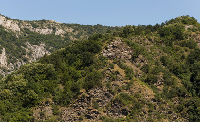 Fototapeta na wymiar Landscape of Bulgaria-mountains, fields, flora. Rhodopes, are a mountain range in Southeastern Europe. Tectonic dislocations.