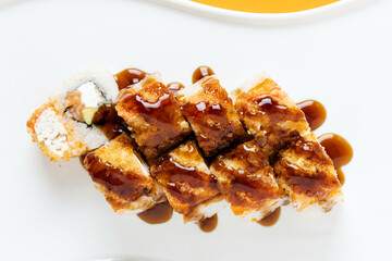 sushi and rolls on an orange background