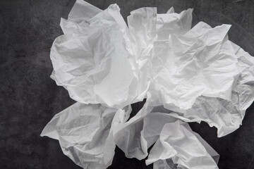 Abstraction. Airy white paper on a black background. Backgrounds and textures