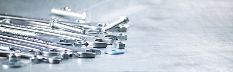 Wrench with nuts and bolts. 